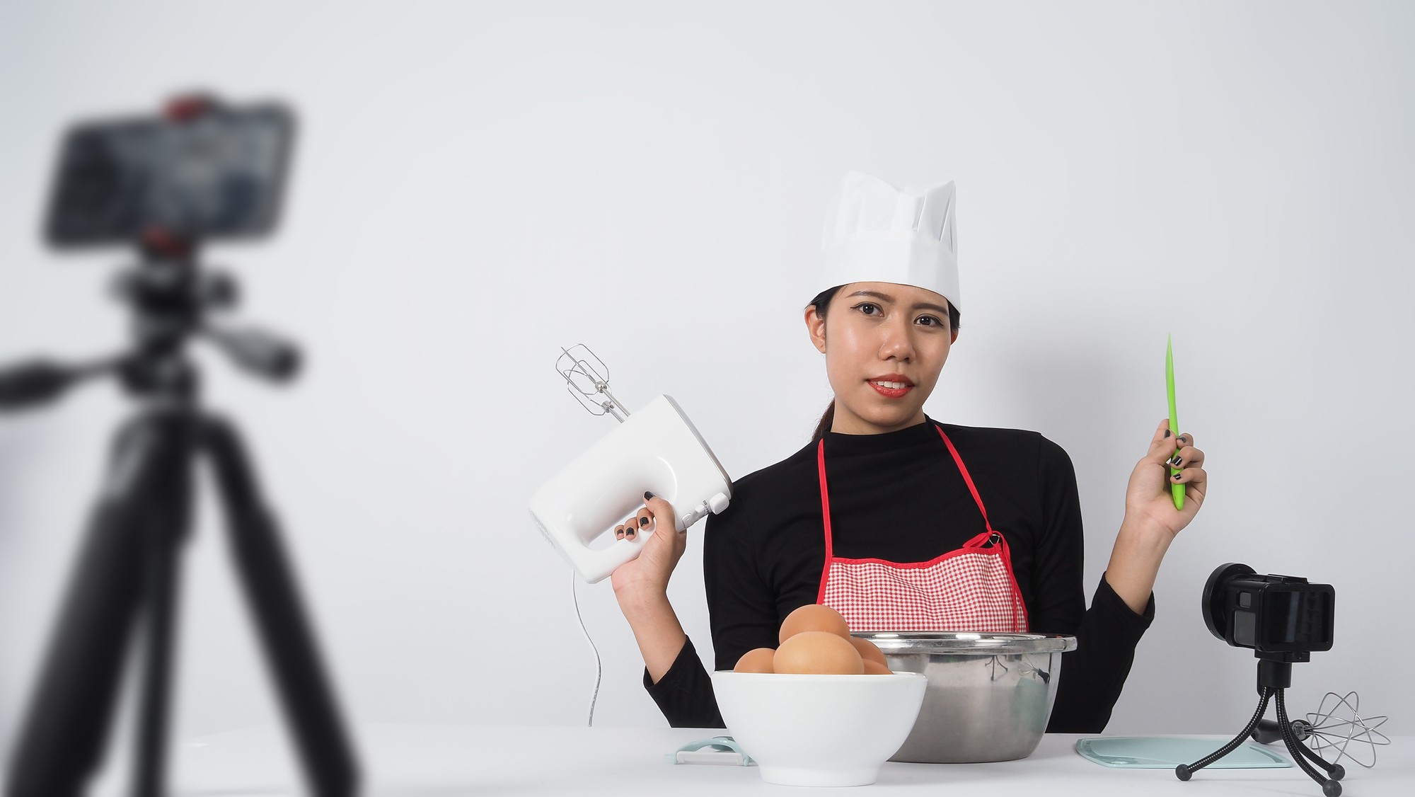 Modern kitchen studio with instructor and camera